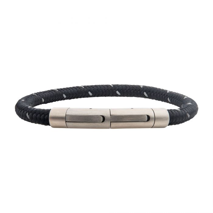 The INOX 6mm Black Reflective Nylon Cord Bracelet, 8.5-8" in length, is a men's black braided bracelet with silver cylindrical magnetic clasps and minimalist design, offering a unique woven texture enhanced by stainless steel elegance.