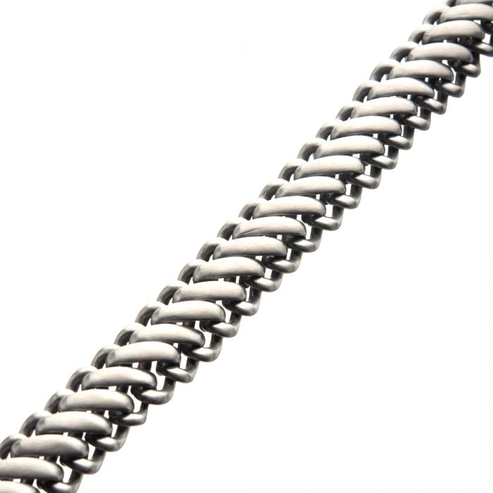 A close-up image of the Matte Stainless Steel Big Double Chain Bracelet by INOX, highlighting its unique, interlocking double chain pattern and sleek matte finish. The bracelet is diagonally positioned, occupying most of the frame against a plain white background, reminiscent of a men's Cuban link necklace in its bold design.