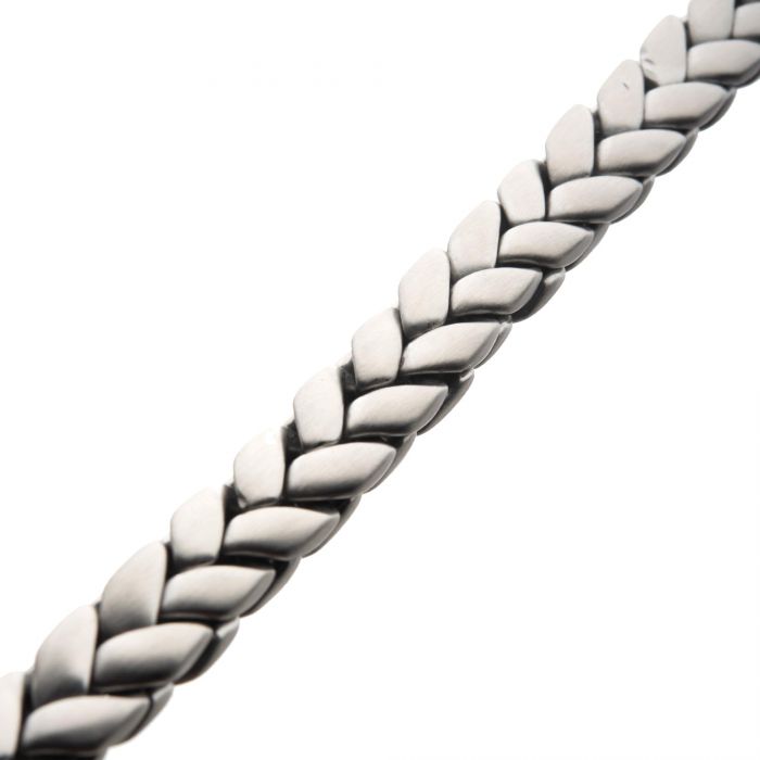 A close-up image of the Matte Stainless Steel Big Double Spiga Chain Bracelet by INOX, showcasing its woven chevron pattern design. The bracelet features a matte stainless steel finish, with smoothly interlocking links that create a sleek and elegant appearance against a plain white background.