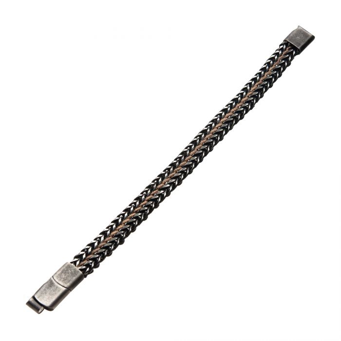 The Allegiance Stainless Steel Bracelet by INOX showcases an intricate, woven design and is elegantly crafted from durable stainless steel. It features stylish contrasting tones of silver and black, with a magnetic slide clasp at each end for secure fastening. This modern piece is perfect for both casual and formal occasions.