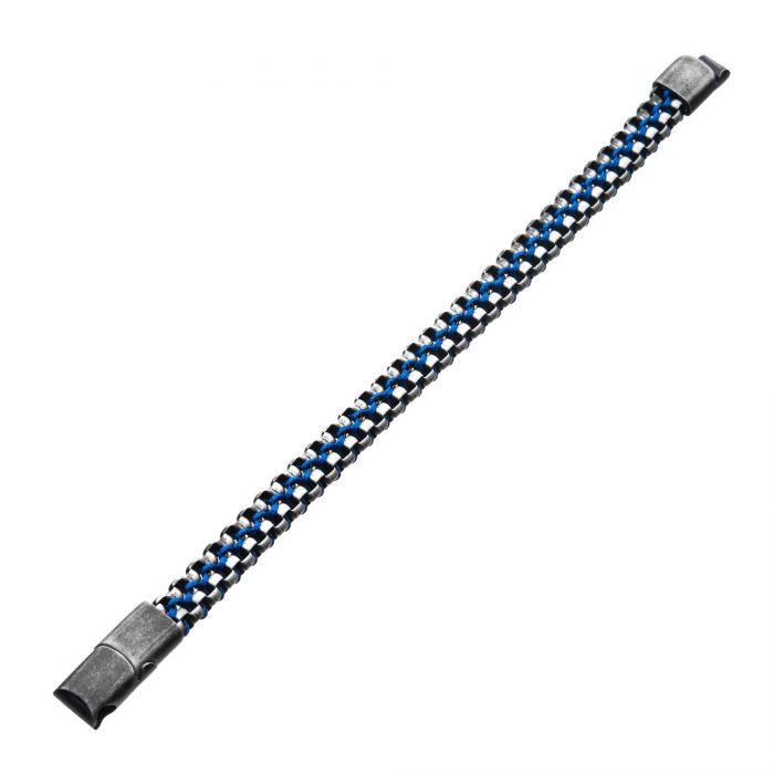 A close-up image of the Allegiance Stainless Steel Bracelet by INOX showcases blue and silver teeth reminiscent of brushed foxtail links. The bracelet's clasp at both ends is slightly visible, with a black fabric strip running along the edges of the links. The background is pure white.
