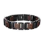 The Men's Stainless Steel Black Plated with Walnut Wood Link Bracelet by INOX features a stylish combination of black and brown rectangular links. The alternating pattern of polished brown walnut wood and matte black stainless steel pieces, complemented by small silver accents, results in a modern and masculine design.