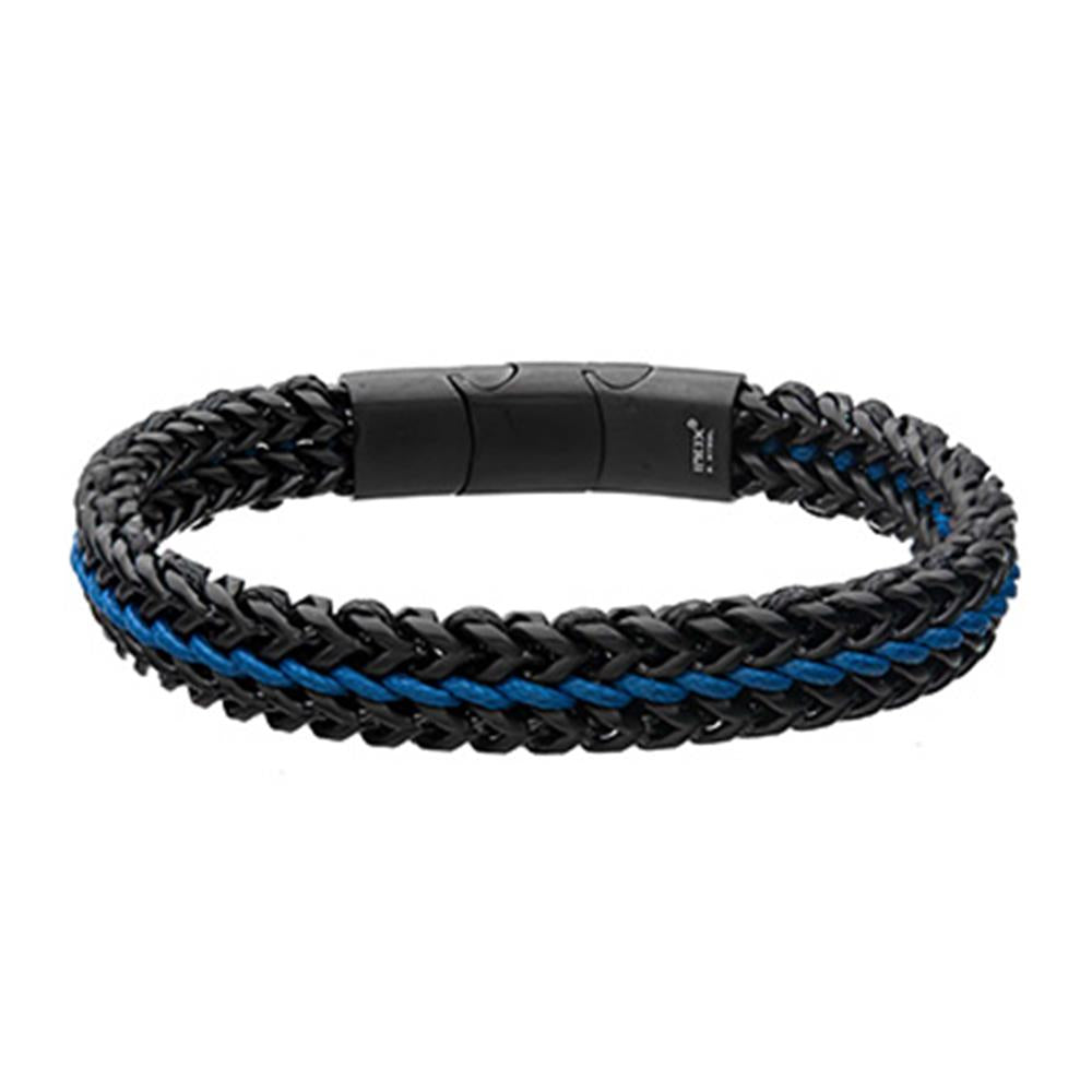 The Allegiance Stainless Steel Bracelet by INOX features a sophisticated black and blue braided design with intertwining strands of blue wax cord, creating a stylish two-toned look. The magnetic slide clasp ensures easy fastening, adding to its sleek and functional appeal.