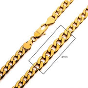 A close-up image of the 4mm 18K Gold Plated Classic Curb Chain by INOX, featuring a lobster claw clasp. The chain's links, which measure 4mm in width, are highlighted within a rectangular box. This men's stainless steel necklace exhibits a smooth and polished texture, showcasing its classic curb chain design in a 20-inch length.