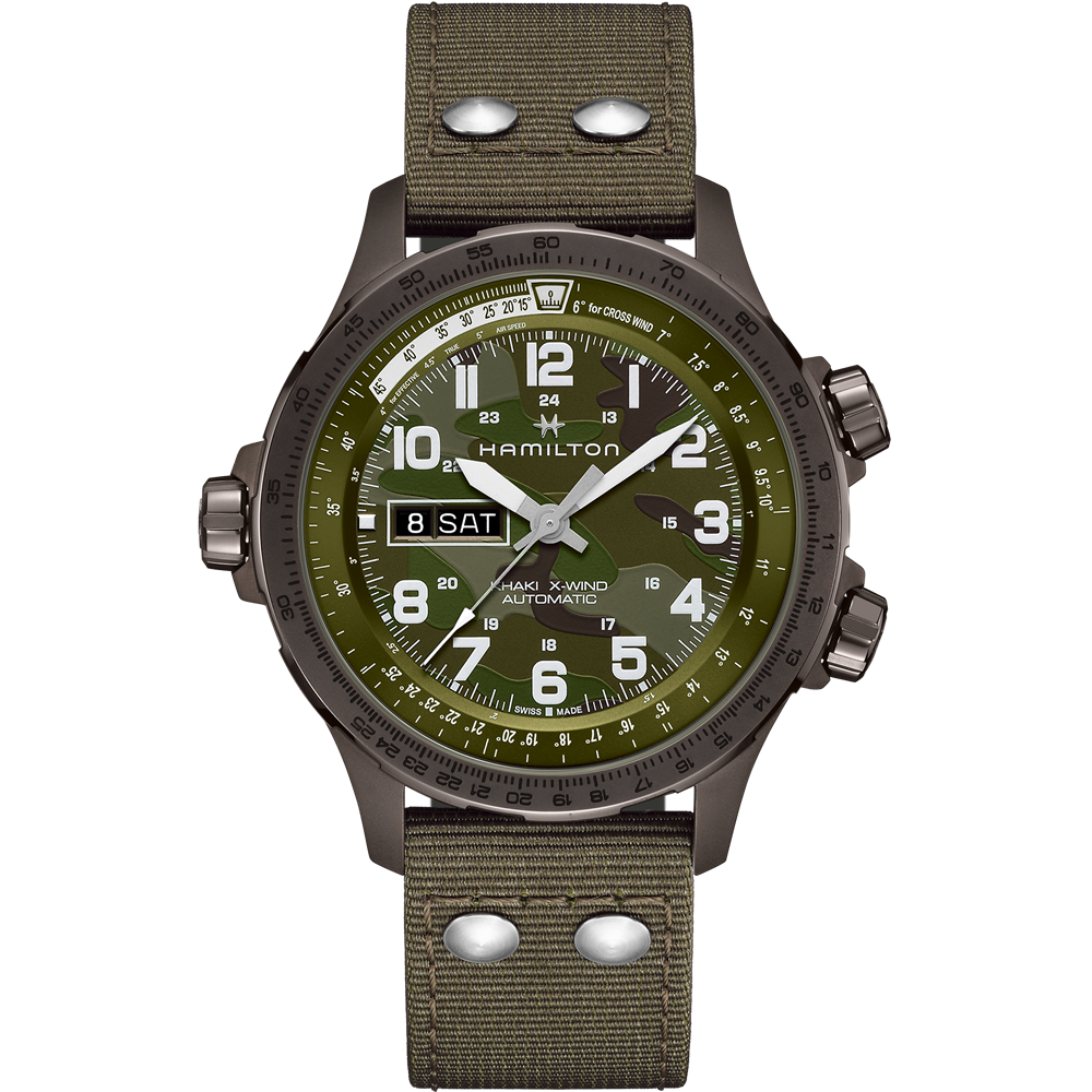 The Hamilton Khaki Aviation X-Wind Automatic Watch features a round face with three hands, displaying both date and day information. It has large white numerals on a camouflage-patterned dial and is equipped with a durable olive-green fabric strap that includes two metal rivets near the lugs. Additionally, there are three function buttons located on the side.