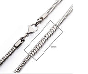 Close-up image of the INOX 3mm Steel Rattail Chain with a lobster clasp. A rectangular box highlights a section of the chain, indicating its 3mm thickness. The white background makes this 24" men's necklace from INOX stand out elegantly.