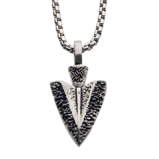 A close-up view of the Antiqued Steel Arrowhead Pendant with Bold Box Chain by INOX, showcasing intricate textures and detailing. The 22-inch necklace features contrasting textures that create a striking design.