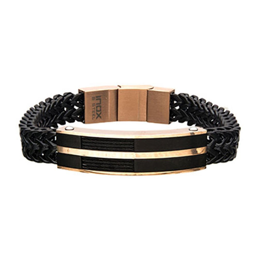 The INOX Men's Stainless Steel Bracelet features a black woven double Franco chain and a gold-toned clasp. The centerpiece showcases a matte black and rose gold-plated striped design with metal cables running through the middle, and the clasp is engraved with "INOX.