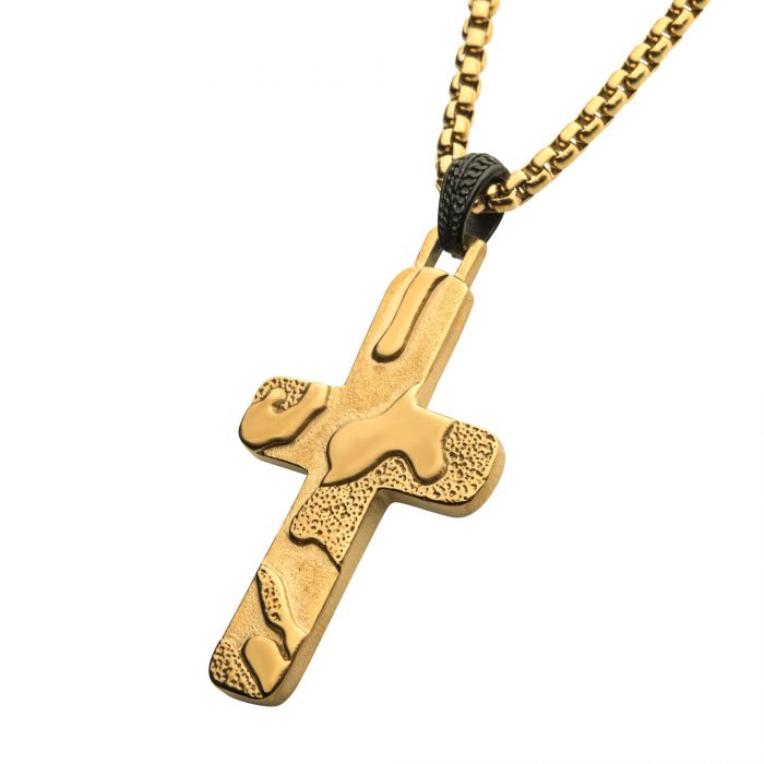 Hanging from a black and gold box chain necklace on a white background is the Stainless Steel High Polished 18K Gold Plated 3D Canyon Pattern cross pendant by INOX. This 18K gold-plated piece combines matte and polished finishes, creating a unique, artistic appearance.