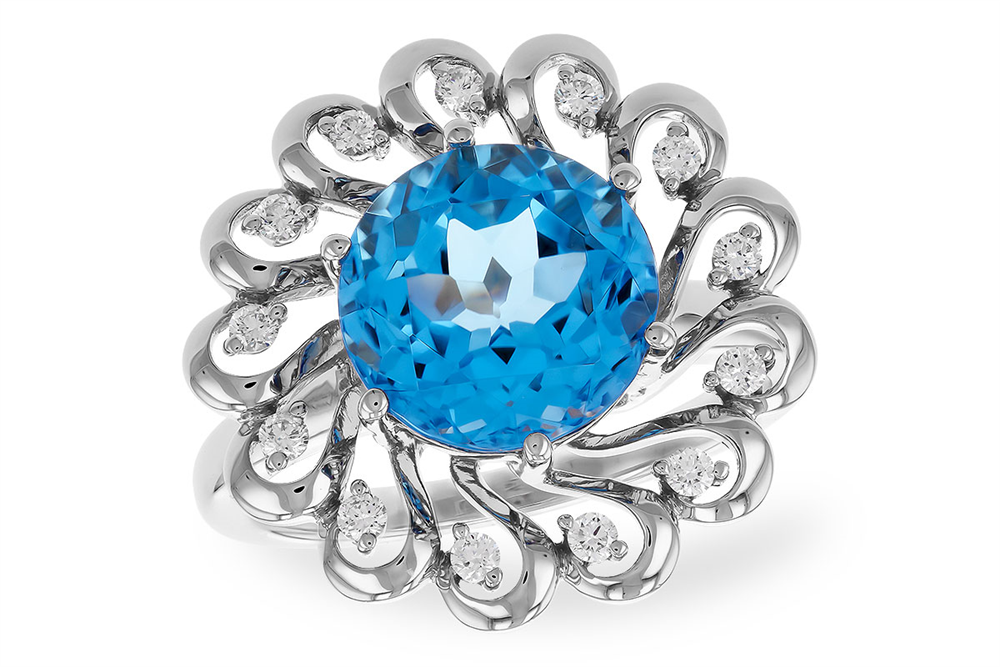 An exquisite creation from Allison Kaufman, the Swiss Blue Topaz and Diamonds 14k White Gold Ring features a stunning large Swiss blue topaz at its center, encircled by intricate loops adorned with small white diamonds, all set in luxurious 14K white gold.