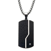 A Men's Stainless Steel dog tag necklace by INOX, featuring a pendant with a stylish black crocodile pattern on the left side and a smooth surface on the right, divided by a diagonal silver stripe. Near the bottom left, there's an elegant 2mm clear CZ gem embedded for an added touch of sophistication. The chain measures 24 inches in length.