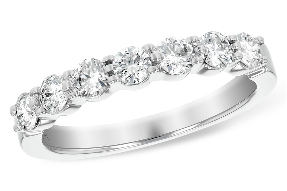 Introducing the Ladies Wedding Band by Allison Kaufman: a minimalist 14k white gold ring featuring a row of prong-set, round-cut diamonds. The evenly spaced gems catch the light beautifully, enhancing their brilliance and clarity.