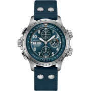 A Hamilton Khaki Aviation X-Wind Automatic Chronograph watch, featuring a silver-toned case and large, detailed face with multiple dials and a date window showing "28" and "SAT." The timepiece includes a blue fabric strap with metallic rivets and a textured band. The background of the image is transparent.