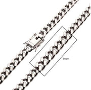A close-up image shows the 6mm Steel Miami Cuban Chain by INOX, showcasing the intricate clasp detail as it lies on a white background. A rectangular measurement annotation highlights the precision-crafted 6mm Cuban chain links, designed for both durability and style.