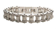 The Steel Bike Chain Bracelet by INOX is a men's stainless steel accessory with modern, industrial aesthetics, featuring interlocking rectangular and hexagonal links. This bracelet resembles a bike chain and includes a secure clasp closure, making it perfect for any stylish individual.