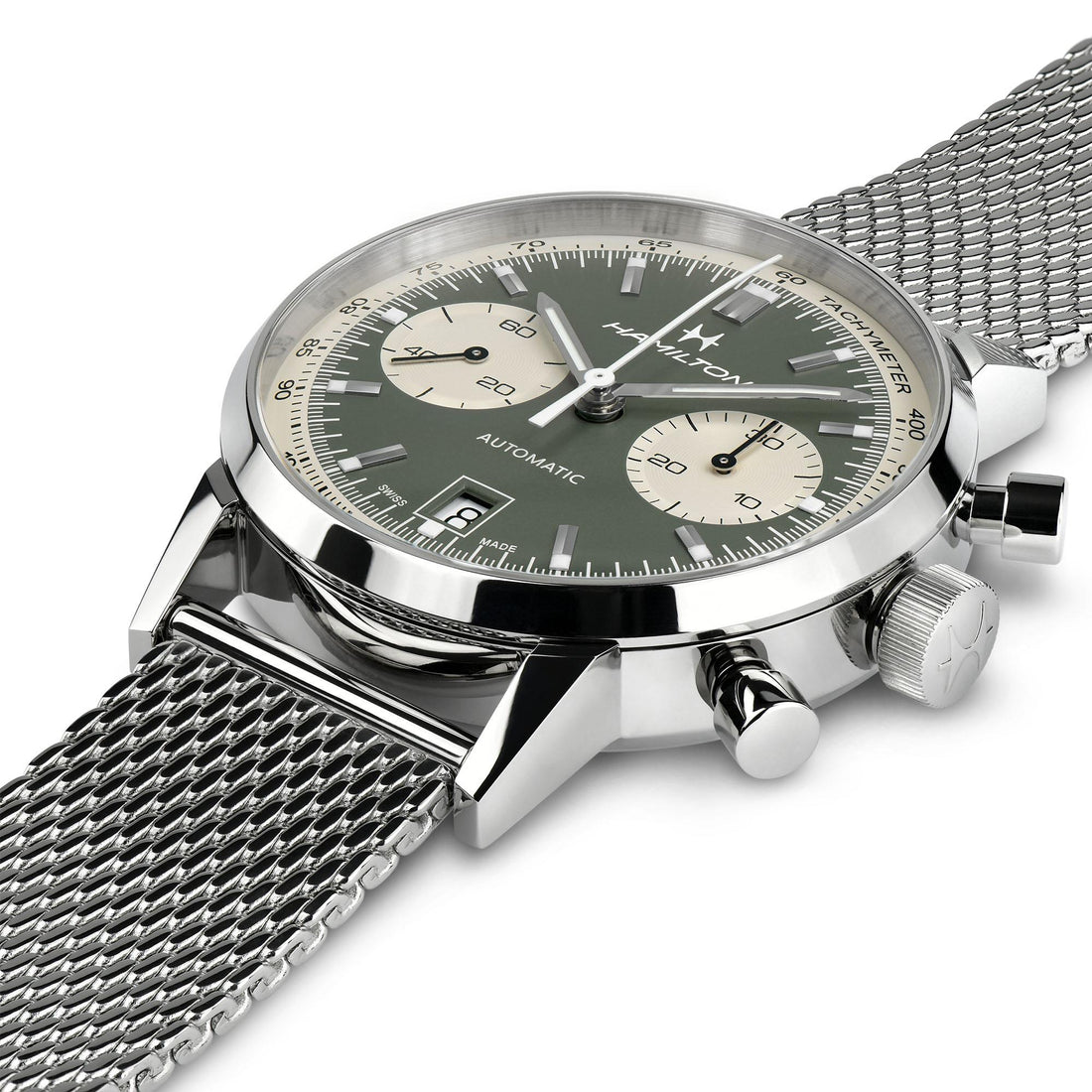 A close-up of the stylish Hamilton Intra-Matic Automatic Chronograph wristwatch with a metallic mesh strap. The 40mm watch features a green dial with two subdials, silver hands, and a silver case. It boasts automatic movement and chronograph functionality, combining modern precision with vintage appeal.