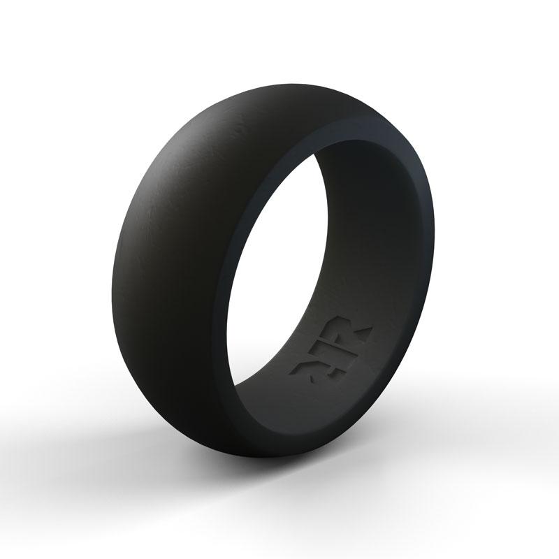 A Baxley Jewelry Men's Black Silicone Wedding Ring is displayed on a white background. The ring features a smooth, matte finish perfect for active lifestyle rings. Inside the band, there is a small, subtle design or logo, though it's not entirely clear what the design depicts.