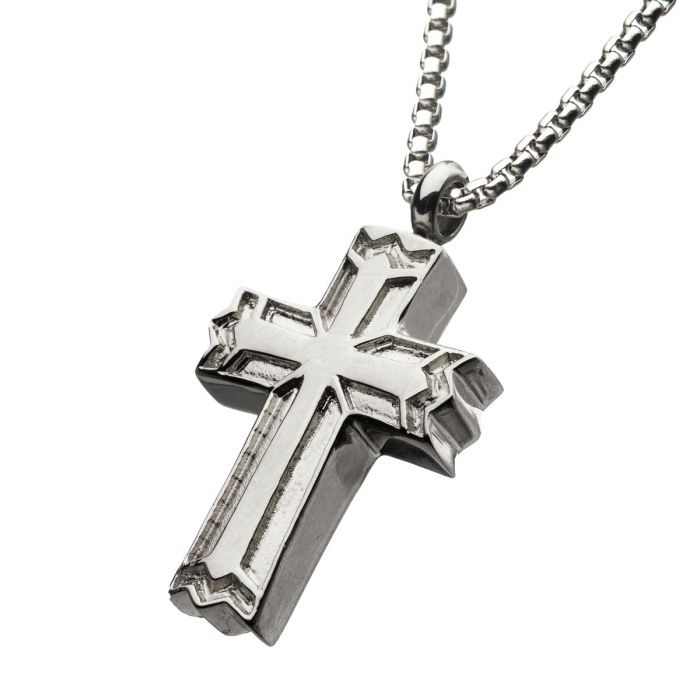 A Stainless Steel Memorial Gothic Cross Pendant with a sleek box chain from INOX is showcased against a white background. This men's pendant features a layered, three-dimensional design with a detailed border.