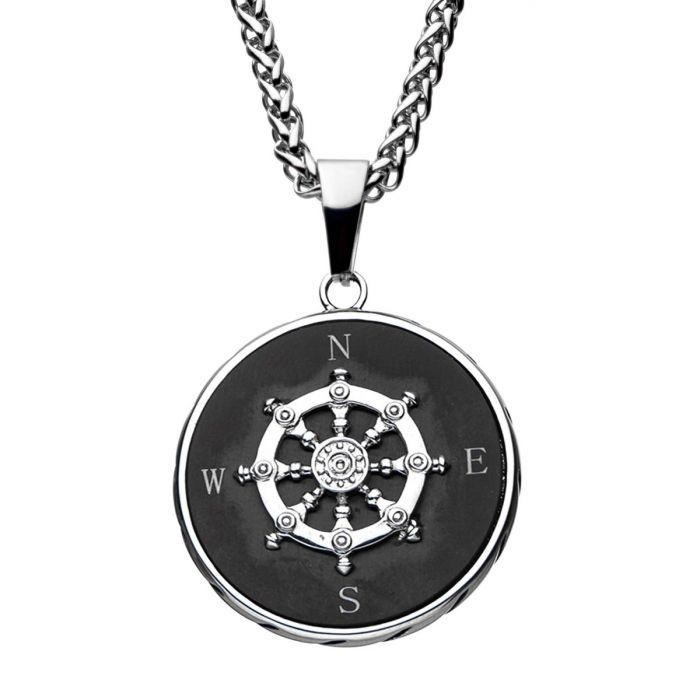 The stainless steel black plated compass pendant from INOX features a men's pendant shaped like a ship's wheel, marked with N, E, S, and W for north, east, south, and west. The circular pendant has a black background and comes with a thick black plated chain.