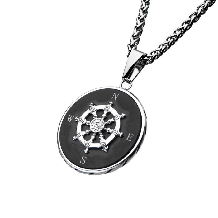 The INOX Stainless Steel Black Plated Ship's Wheel Compass Pendant with Chain features a detailed ship's wheel design with directional markers (N, E, S, W) on a black background. The pendant is paired with a thick, interwoven black plated chain for a nautical and elegant style.