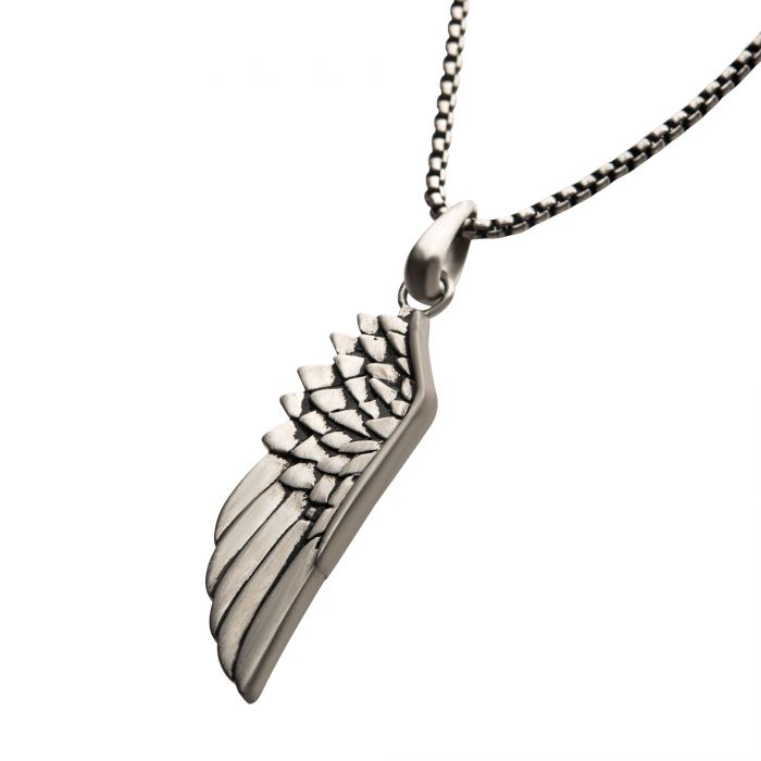 Experience the elegance of the INOX Steel Wing Pendant with a detailed angel wing pendant. The intricately feathered wing hangs from a sleek, black oxidized steel box chain, 24 inches in length, secured with a delicate clasp. Set against a white background to highlight its refined design, this men's necklace from INOX exudes sophisticated charm.