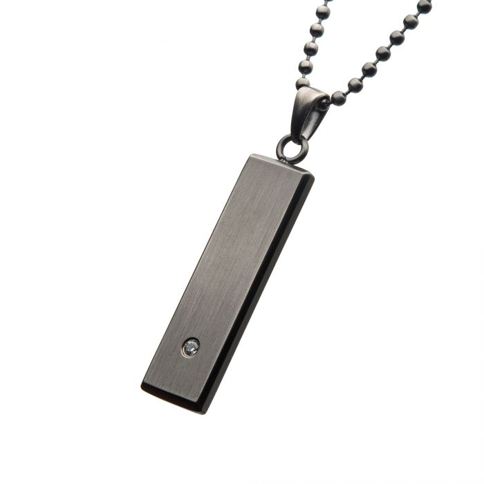 A silver rectangular men’s stainless steel pendant featuring a small 2mm clear CZ near the bottom hangs from a silver beaded ball chain against a white background; it’s the Stainless Steel with 2mm Clear CZ Tag Pendant with Ball Chain by INOX.